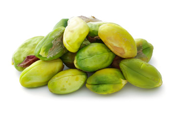 Heap of peeled pistachio nuts isolated