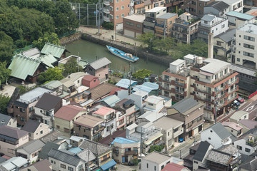 Obraz premium Aerial view of Tokyo suburb with residential buildings and modern skyscrapers