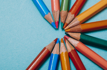 color pencils on a blue background