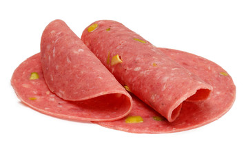 Spanish salami slices with pistachio, isolated