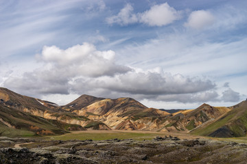 Landmannalaugar Valley. Iceland. Colorful mountains on the Laugavegur hiking trail. The combination of layers of multi-colored rocks, minerals, grass and moss