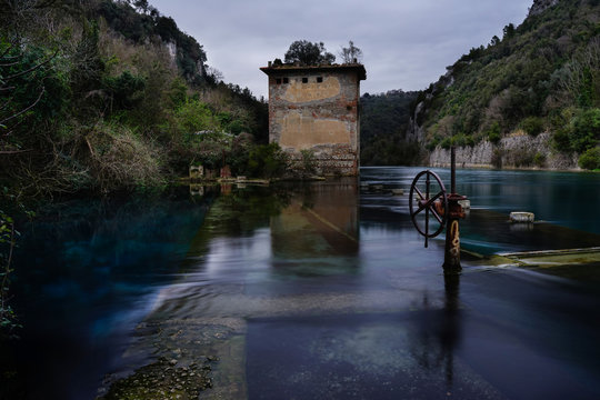 Ancient shipyard and abandoned building on Nera River near Stifone, Narni, Terni, Umbria, Italia