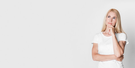 Portrait of middle aged woman looking away at studio