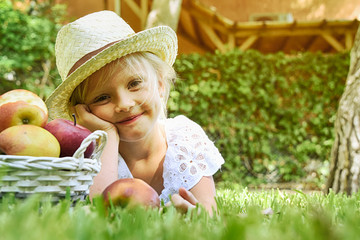 Little girl  portrait on the summer garden background