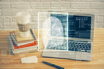 Computer on desktop in office with finger print drawing. Double exposure. Concept of business data...