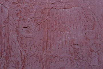 abstract background of an old concrete wall painted in brown close up