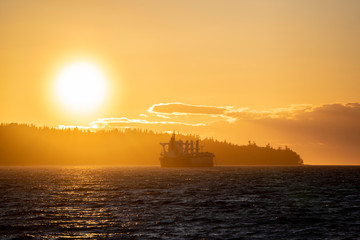 Large cargo transportation boat waiting empty near island ground coast pacific north west china corona virus canada 