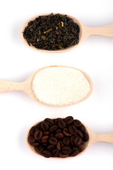 coffee beans in a spoon. tea in a spoon