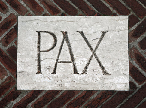 Latin writing PAX which means peace on the floor of a church