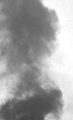 black smoke rises up and the white background