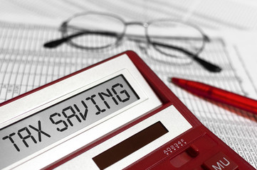 Word Tax Saving on calculator. Business and tax concept.