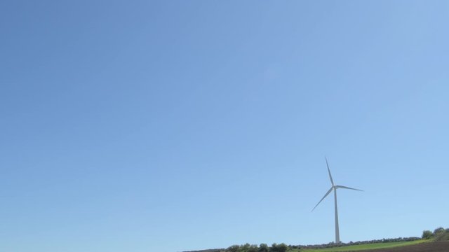 Wind turbine of renewable energy moving blades a sunny day