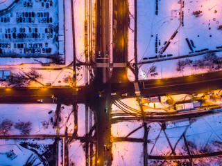 Aerial winter sunset drone view. Crossroads of walkways in the residential district