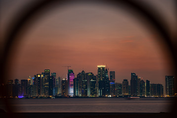 Vibrant Skyline of Doha at Night as seen from the opposite side of the capital city bay sunset