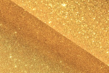 Golden abstract background, seen in two planes, with stars reflecting the light