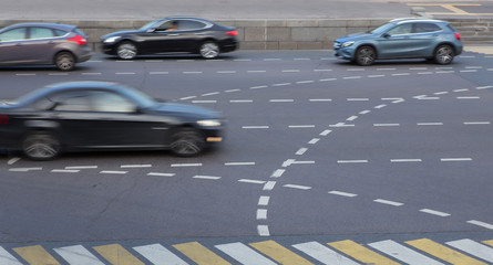 Car traffic on a multi-lane highway in the afternoon.