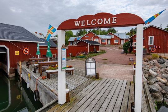 Finland, Aland Islands, Lappo, Velcom inscription on the main pier for yachts and motor boats of Lappo island. Friendly residents of Aland.