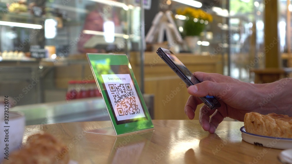 Wall mural qr code cashless payment. scan to pay system. business or technology concept: using smartphone for s