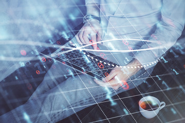 Forex graph with businessman working on computer in office on background. Concept of analysis....