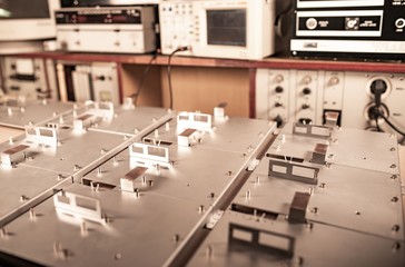 Metal boards and accessories lie on the surface