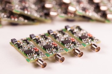 Close-up of four small microcircuits PCB