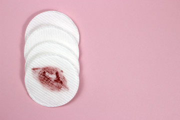 Lipstick imprint on a hygienic cotton pad