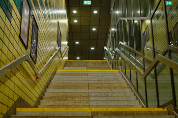 Stairs of a subway station in Hamburg in Germany Europe in black and white optics with emergency exit sign