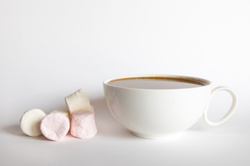Marshmallow with coffee or hot chocolate on a white background, sweet food background