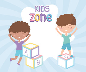 Obraz na płótnie Canvas kids zone, cute little boys playing with alphabet blocks toys
