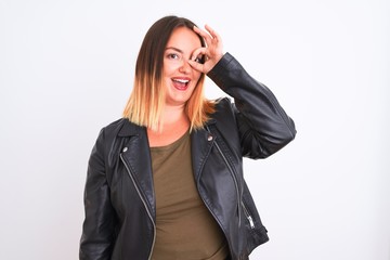 Young beautiful woman wearing t-shirt and jacket standing over isolated white background doing ok gesture with hand smiling, eye looking through fingers with happy face.