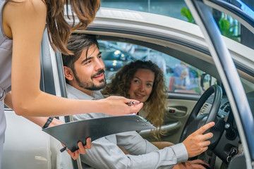 This is the moment we have wait! The couple buying a new car at car dealership