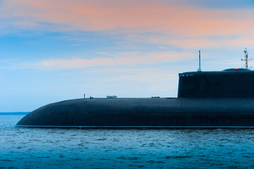 Submarine close-up. Submarine on the background of the evening sky. Fleet. Military conflicts at...