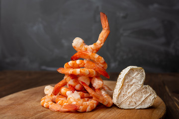 Neufchatel, French cheese made in Normandy from cow's milk and king prawns