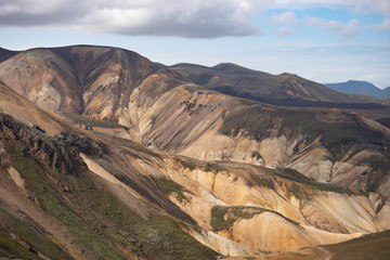 Landmannalaugar Colorful mountains on the Laugavegur hiking trail. Iceland. The combination of layers of multi-colored rocks, minerals, grass and moss