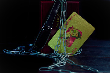 watch and joker card stand before woodbox