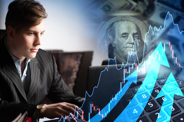 A person at a computer studies data on the course of exchange trading. Increase in the share price...