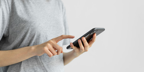 woman holding and using smartphone typing sms message at social network.