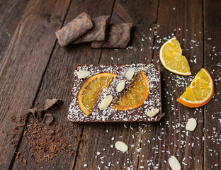  black chocolate with orange on background