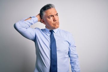 Middle age handsome grey-haired business man wearing elegant shirt and tie confuse and wondering...