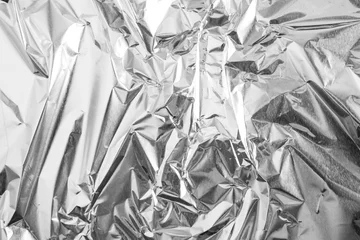 Foto op Aluminium aluminium foil crumpled Silver texture abstract background © Nattapol_Sritongcom