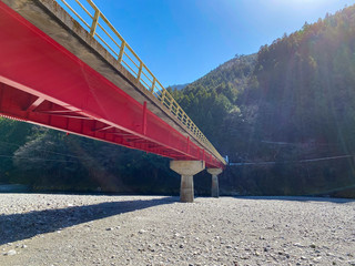 A bridge over a Japanese river.