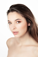 Fototapeta premium Portrait of an attractive young woman under white background