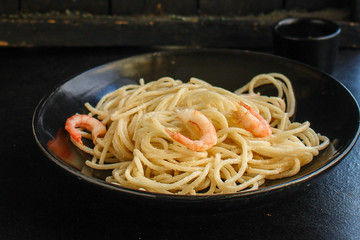 pasta prawn (spaghetti shrimp cream sauce and seafood ) menu concept. food background. top view. copy space