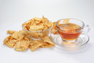 Keropok Tauhu tofu flower sugar chips with blackseed with cup of transparent licker tea