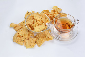 Keropok Tauhu tofu flower sugar chips with blackseed with cup of transparent licker tea