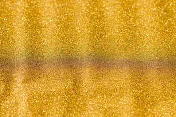 Gold background light. Golden glitter texture.