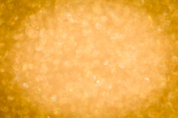 Gold background light. Golden glitter texture.