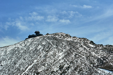 mountain slope and shelter in winter in the Giant Mountains, Poland .