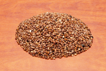 raw buckwheat on a wooden background