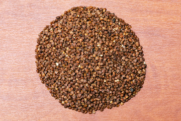 raw buckwheat on a wooden background